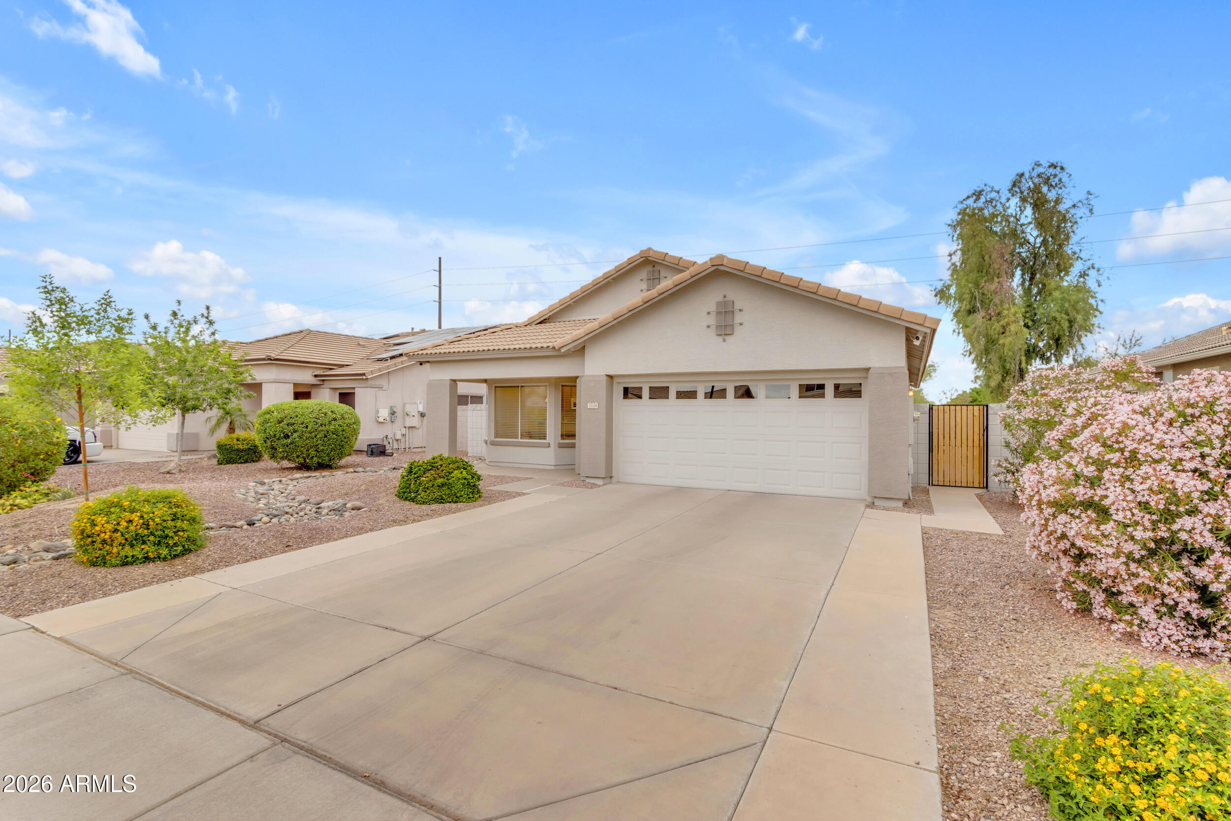 3724 East Derringer Way Gilbert, AZ 85297 - Photo 2 of 45 a view of a house with a yard and potted plants