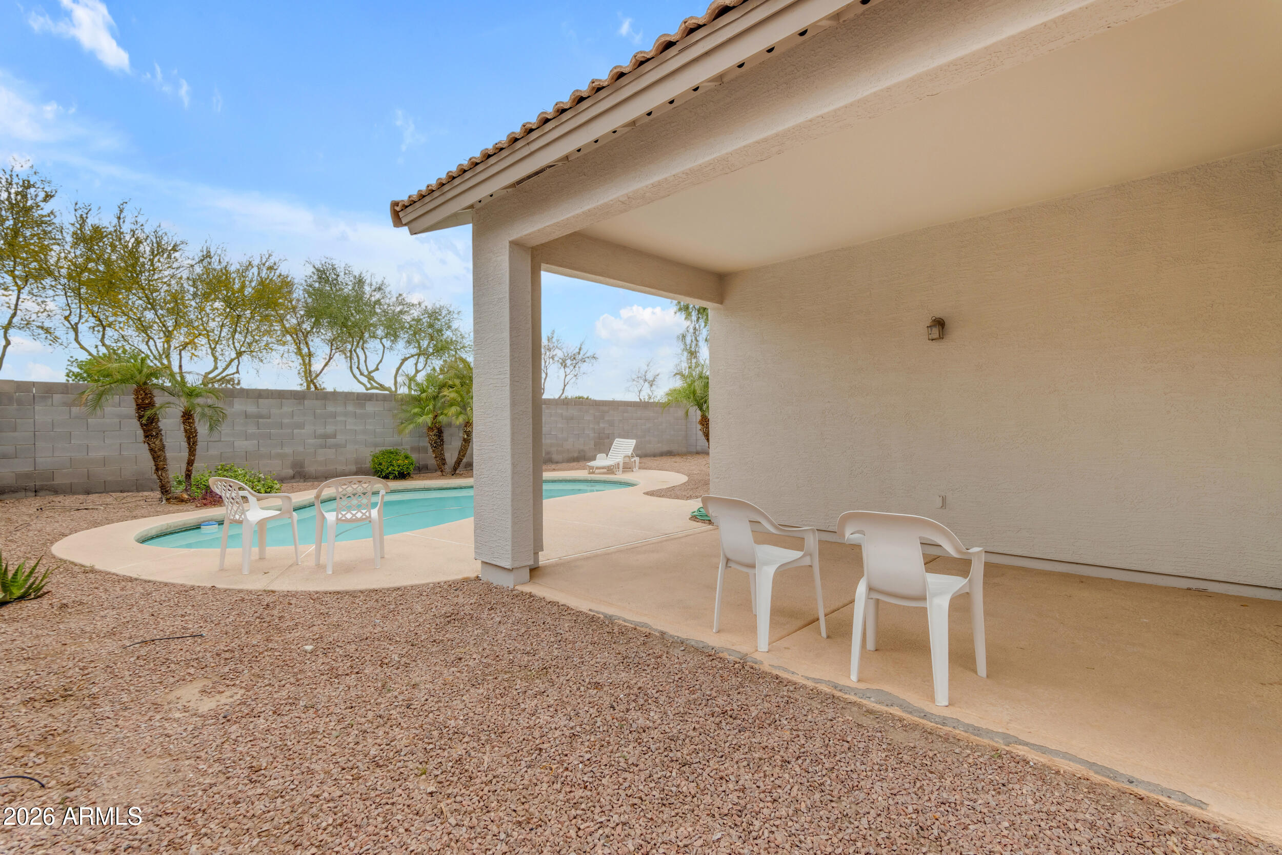 3724 East Derringer Way Gilbert, AZ 85297 - Photo 30 of 45 a view of a chairs and table in the patio