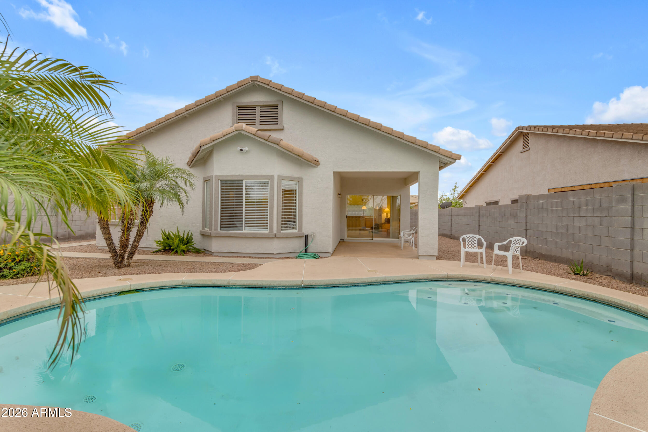 3724 East Derringer Way Gilbert, AZ 85297 - Photo 32 of 45 a front view of a house with a yard