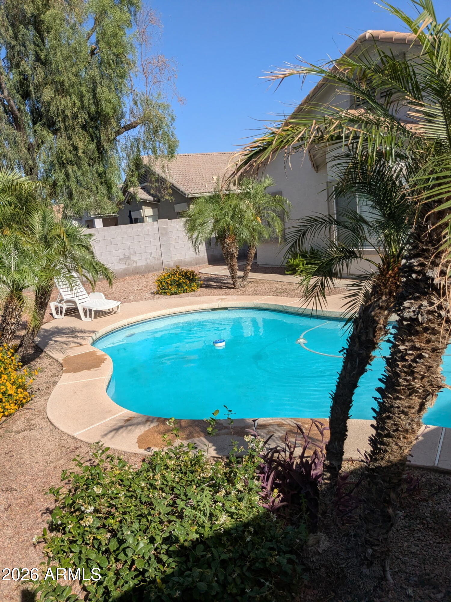 3724 East Derringer Way Gilbert, AZ 85297 - Photo 36 of 45 a view of a swimming pool with an outdoor space and seating area