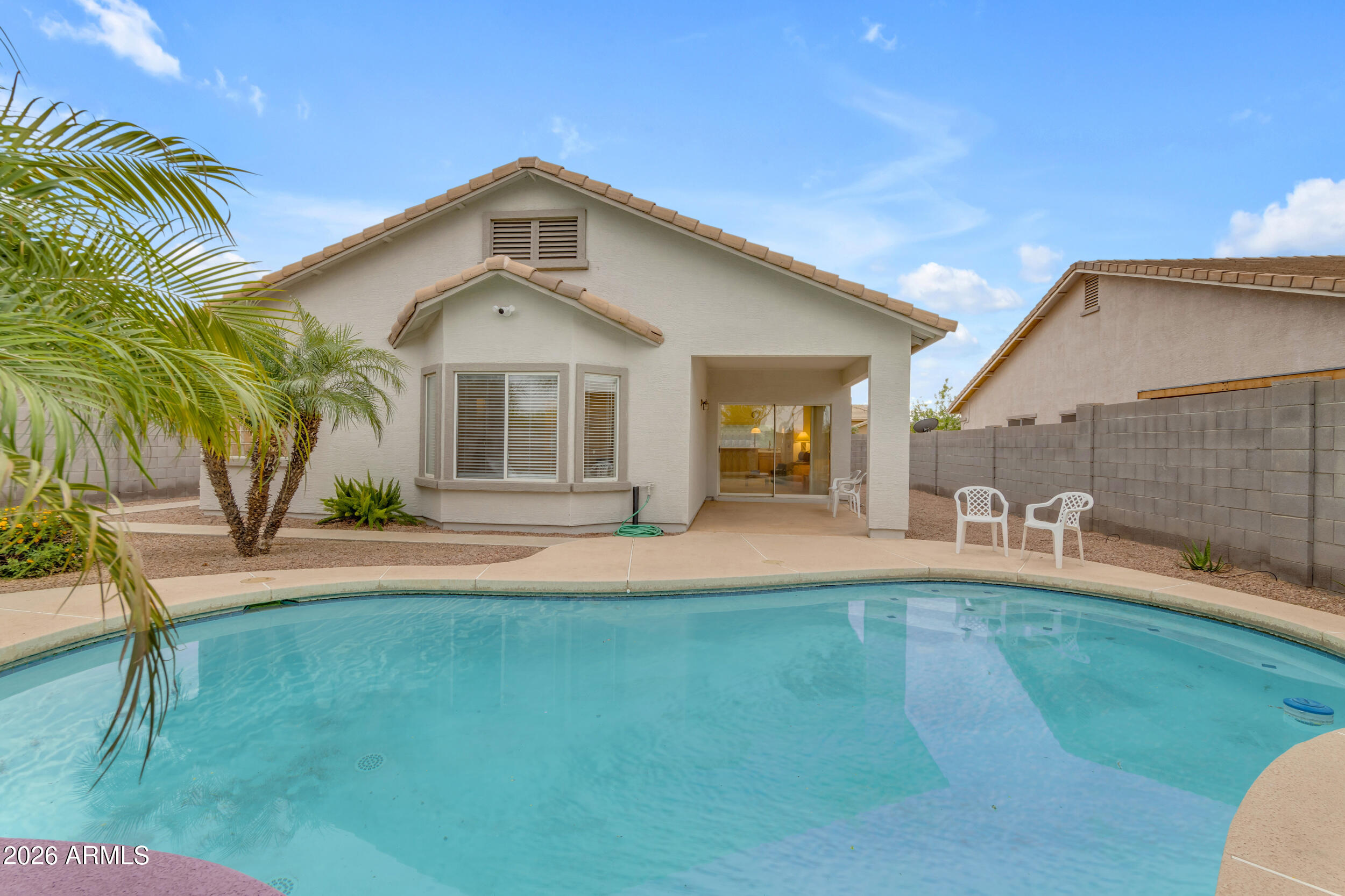 3724 East Derringer Way Gilbert, AZ 85297 - Photo 38 of 45 a front view of a house with a yard