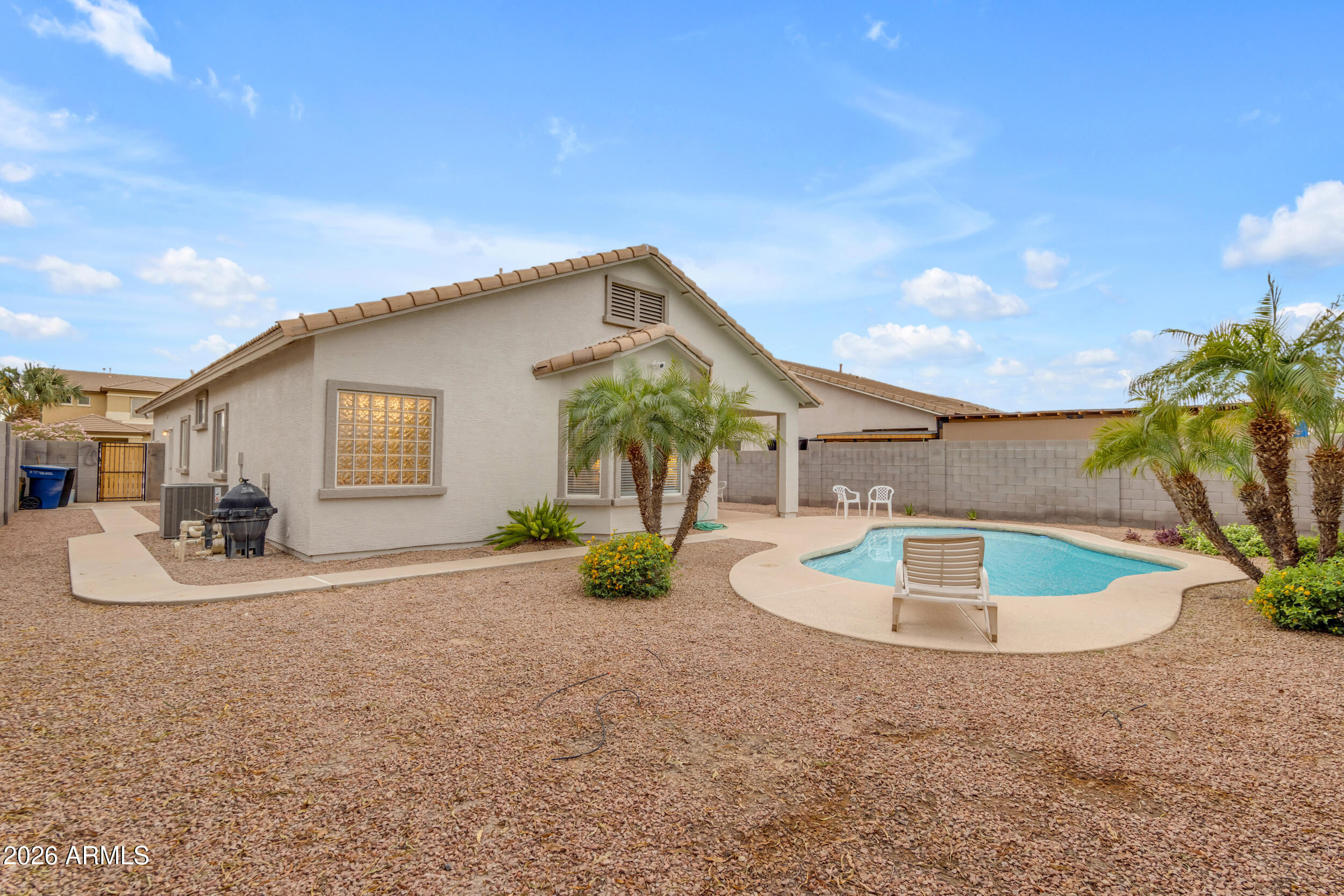 3724 East Derringer Way Gilbert, AZ 85297 - Photo 39 of 45 a view of a house with backyard and swimming pool