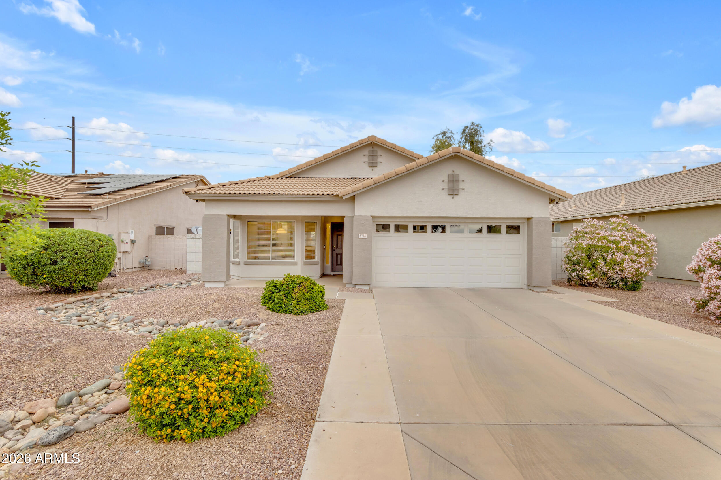 3724 East Derringer Way Gilbert, AZ 85297 - Photo 43 of 45 a front view of a house with garden