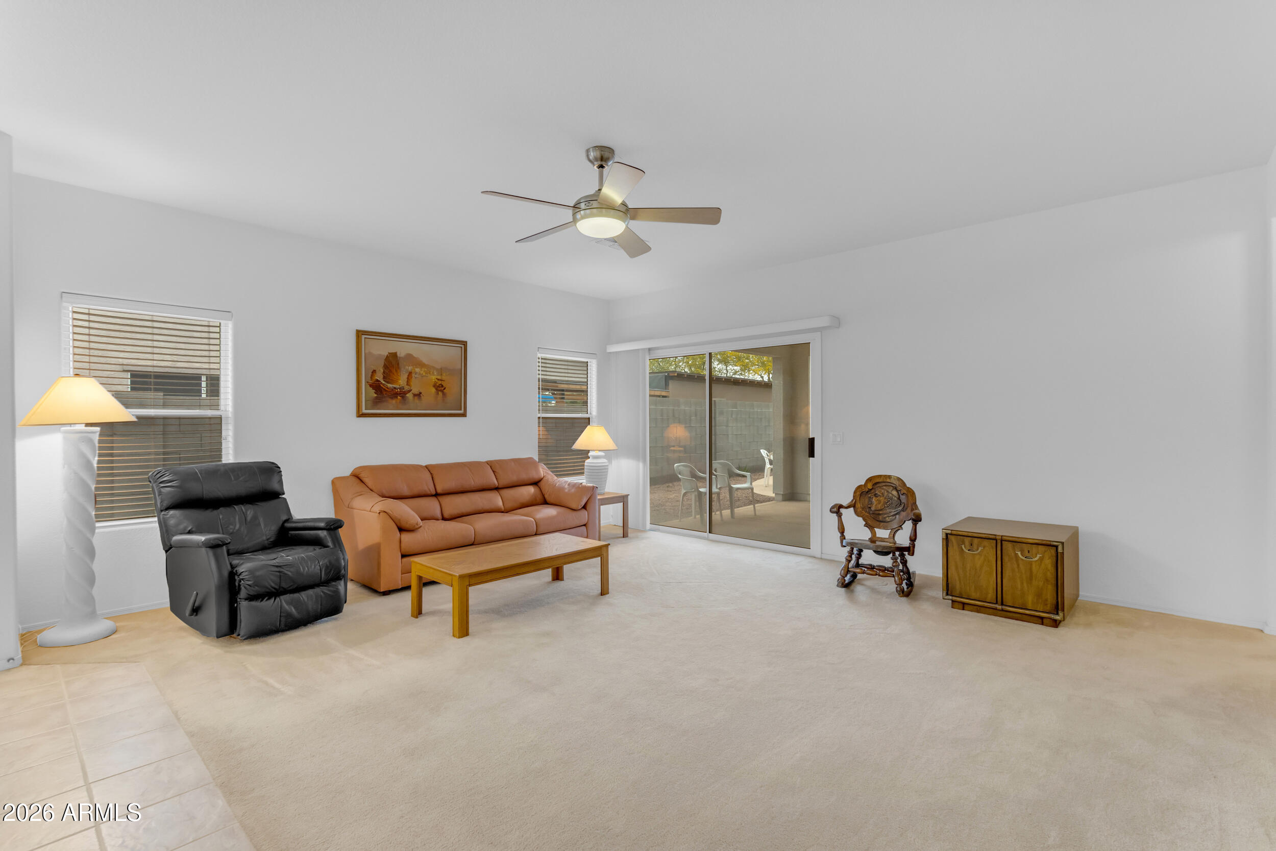 3724 East Derringer Way Gilbert, AZ 85297 - Photo 7 of 45 a living room with furniture gym equipment and a window