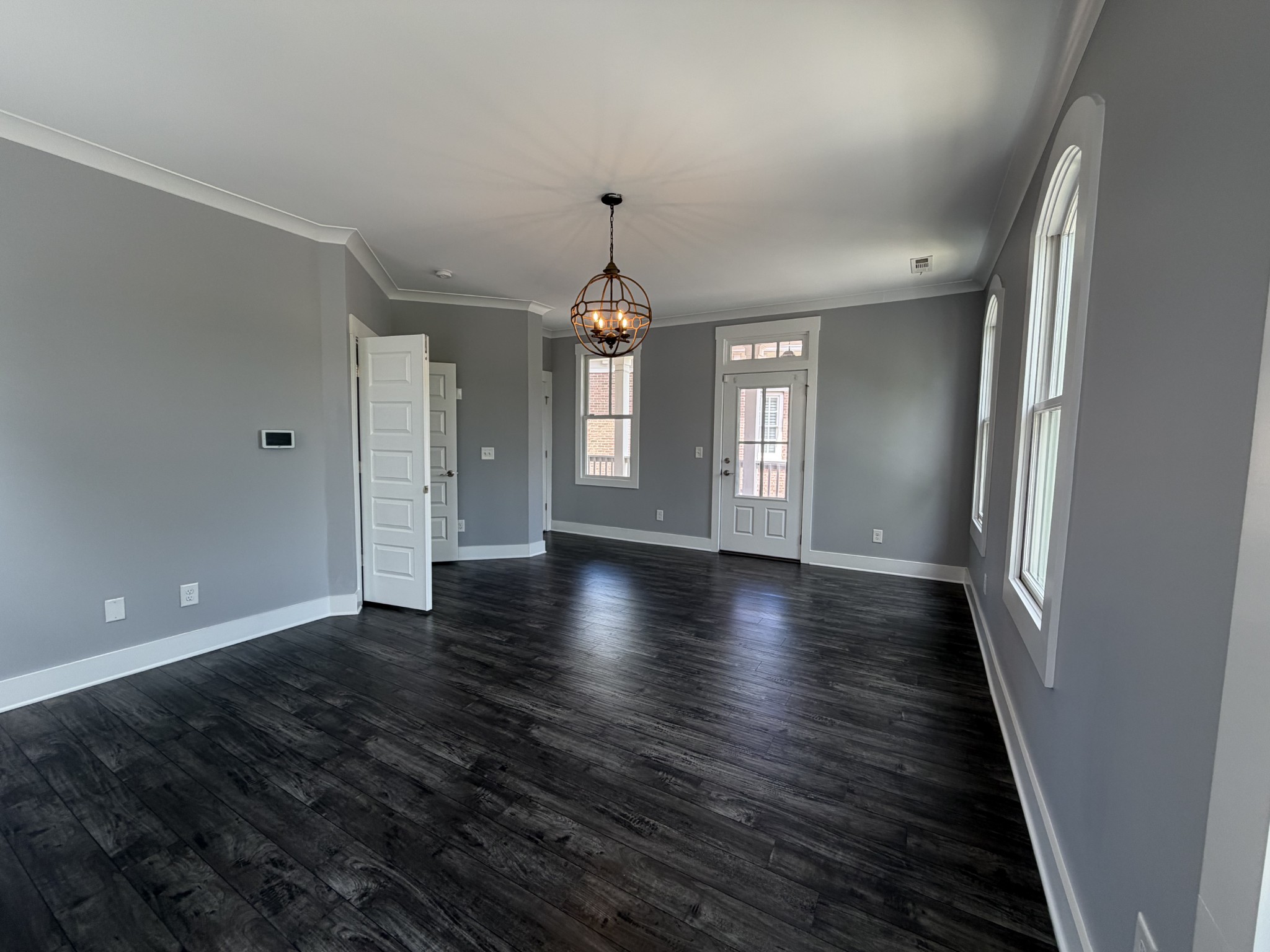 3097 Rural Plains Circle Franklin, TN 37064 - Photo 14 of 28 an empty room with wooden floor and windows