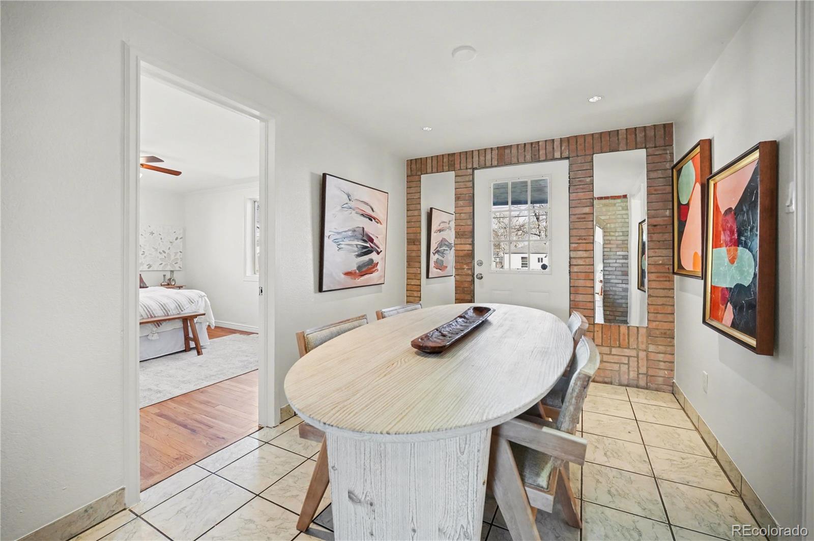 4870 Raritan Street Denver, CO 80221 - Photo 12 of 21 a living room with furniture and wooden floor