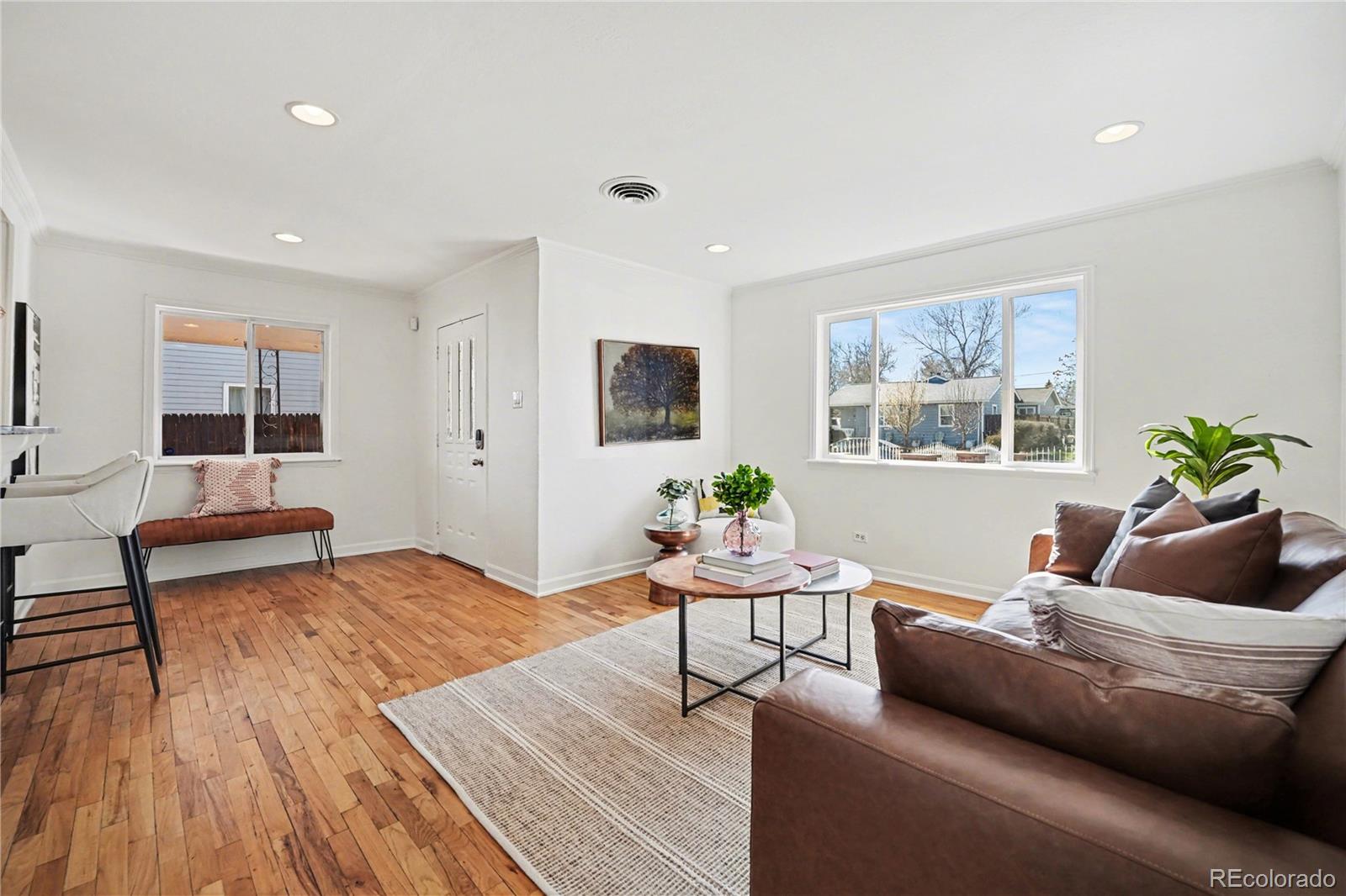 4870 Raritan Street Denver, CO 80221 - Photo 6 of 21 a living room with furniture and a wooden floor