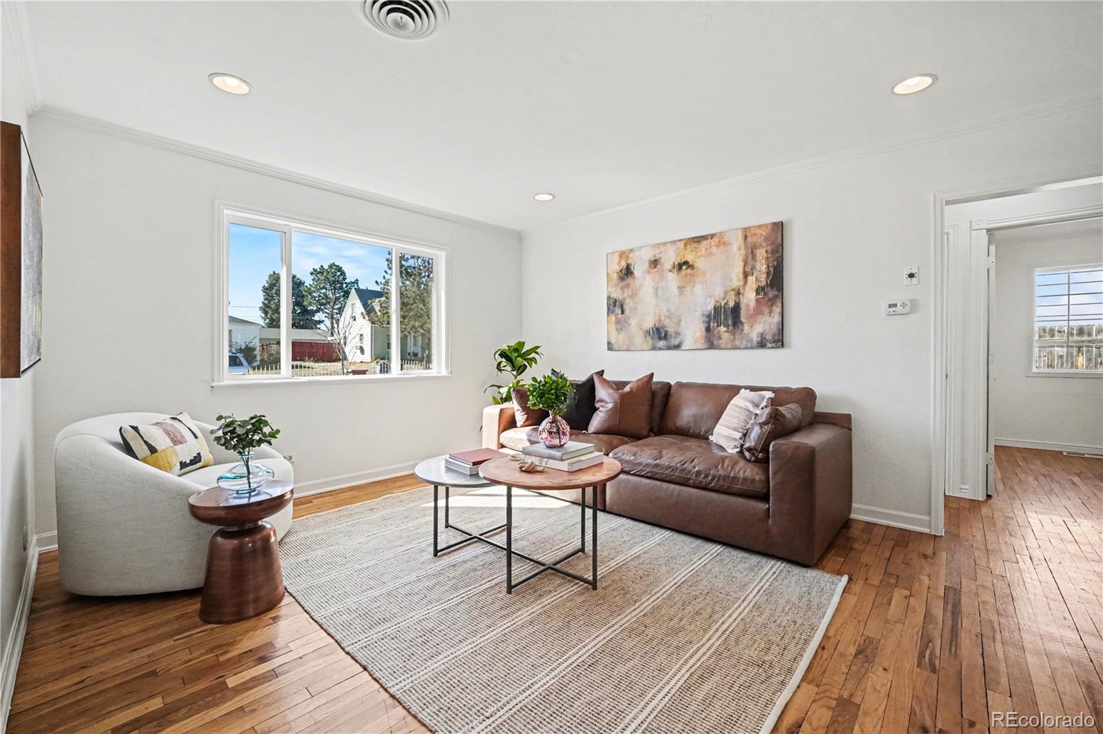 4870 Raritan Street Denver, CO 80221 - Photo 7 of 21 a living room with furniture and wooden floor