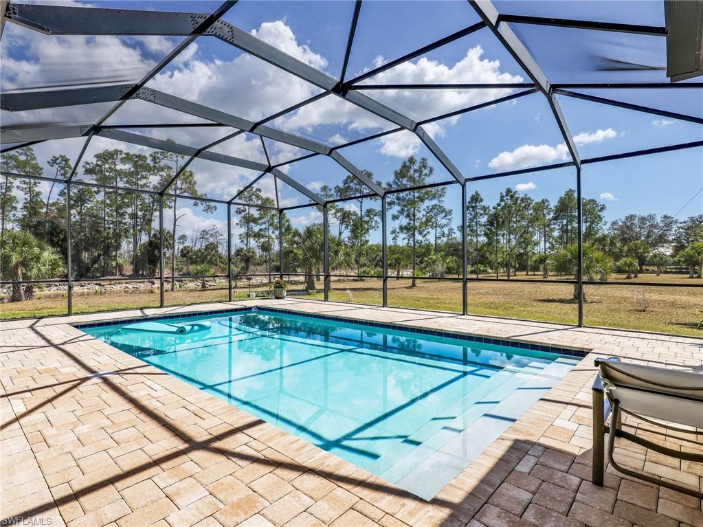 3160 27th Avenue Southwest Naples, FL 34117 - Photo 6 of 43 a view of a swimming pool with a patio
