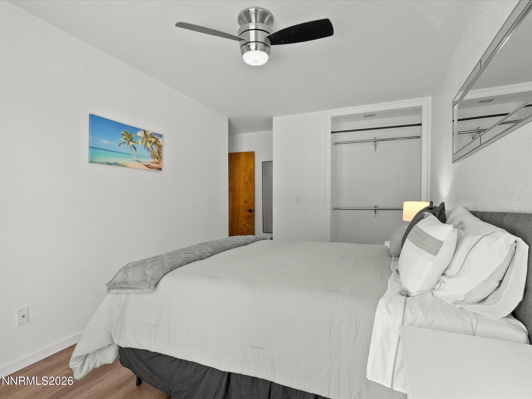 449 Andria Drive Stateline, NV 89449 - Photo 39 of 77 a bedroom with a bed and a painting on the wall