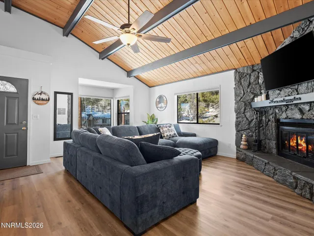 a kitchen with granite countertop a sink stainless steel appliances and cabinets