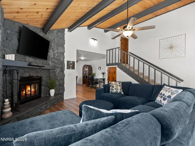 a kitchen with granite countertop a sink stainless steel appliances and cabinets