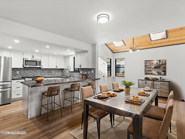 a view of a patio with a table and chairs in the patio