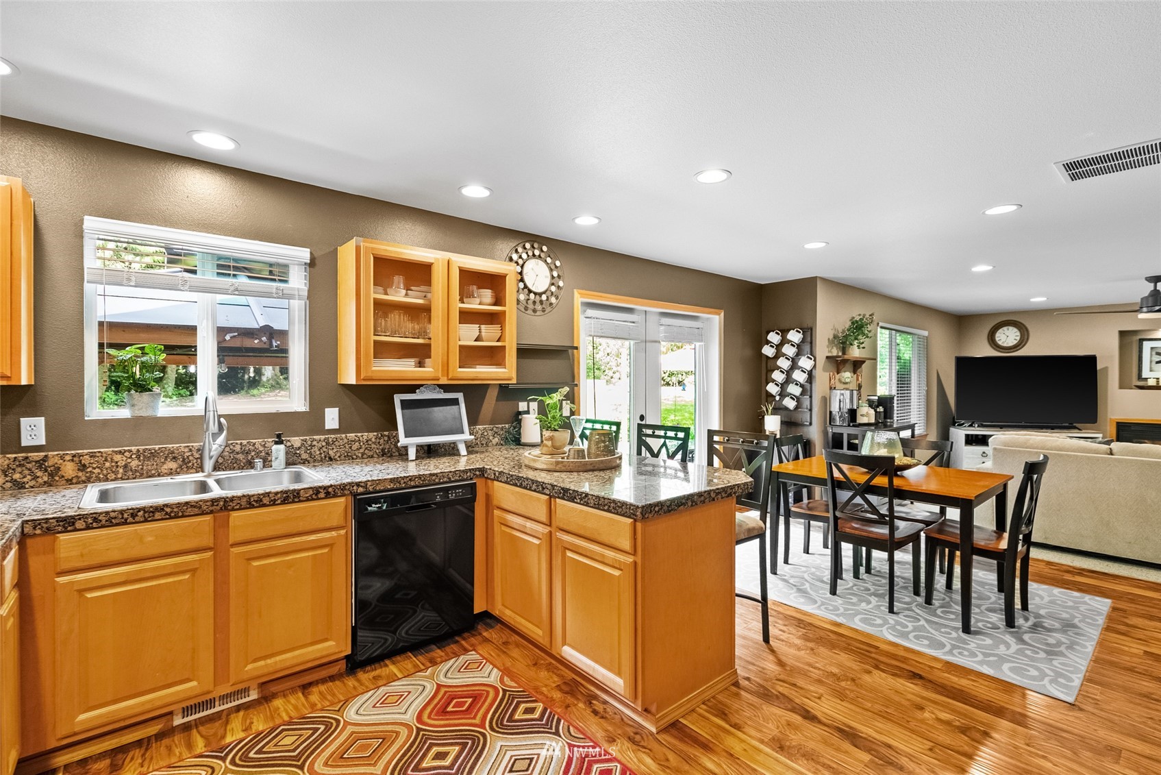 6741 Northwest Ranger Way Silverdale, WA 98383 - Photo 12 of 38 a kitchen with lots of counter top space and dining table