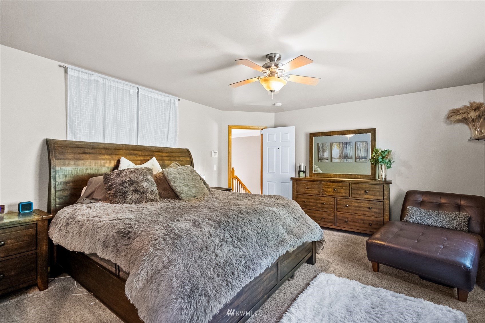 6741 Northwest Ranger Way Silverdale, WA 98383 - Photo 21 of 38 a bedroom with a bed and dresser