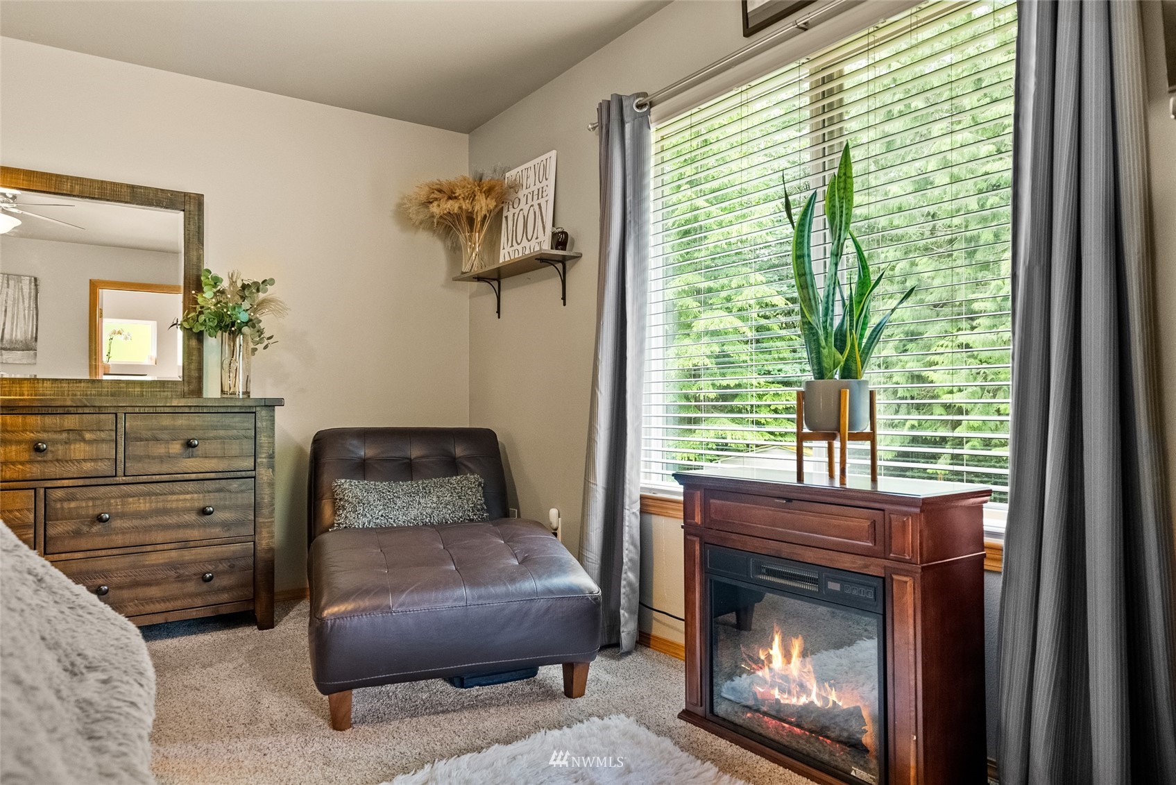 6741 Northwest Ranger Way Silverdale, WA 98383 - Photo 22 of 38 a living room with furniture and a fireplace