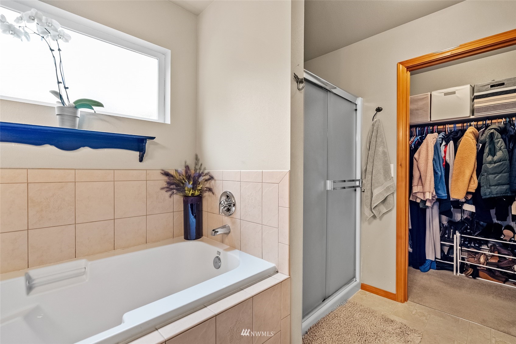 6741 Northwest Ranger Way Silverdale, WA 98383 - Photo 24 of 38 a bathroom with a tub and a shower