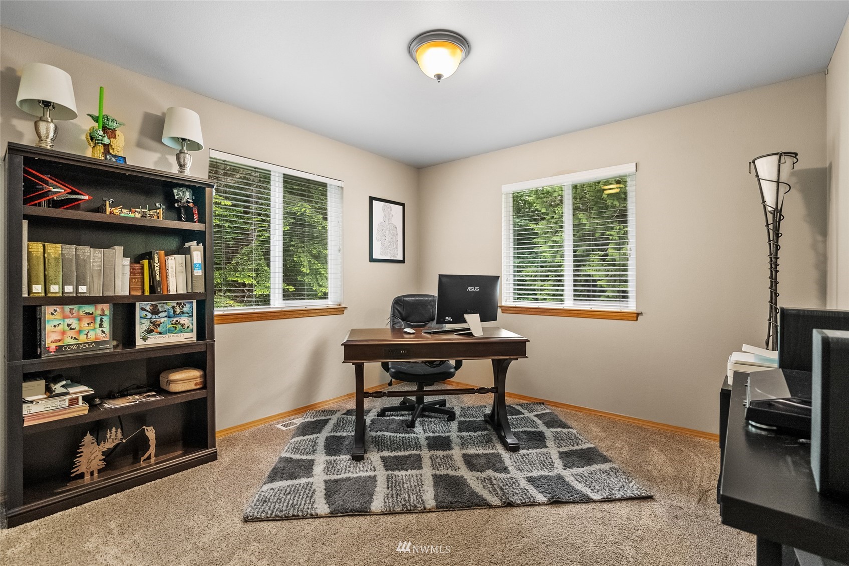 6741 Northwest Ranger Way Silverdale, WA 98383 - Photo 25 of 38 a living room with furniture a rug and a large window