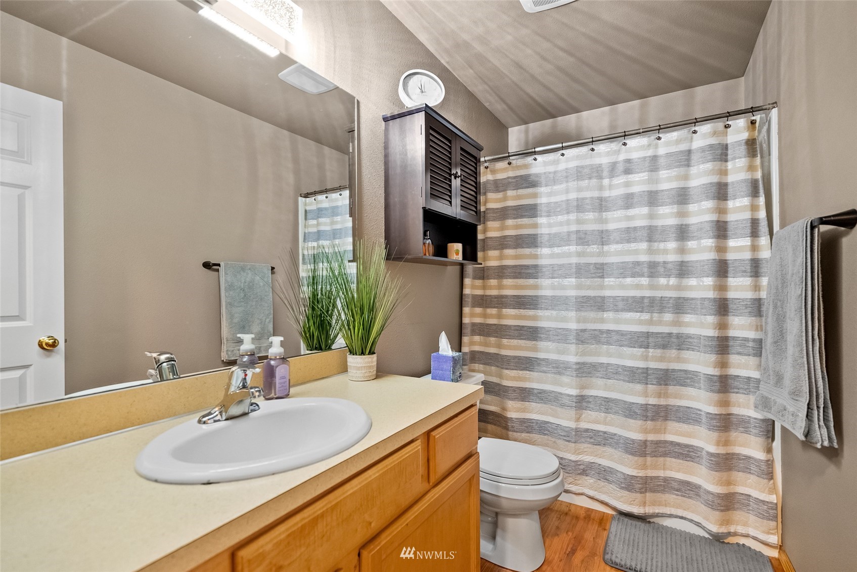 6741 Northwest Ranger Way Silverdale, WA 98383 - Photo 29 of 38 a bathroom with a sink toilet and shower