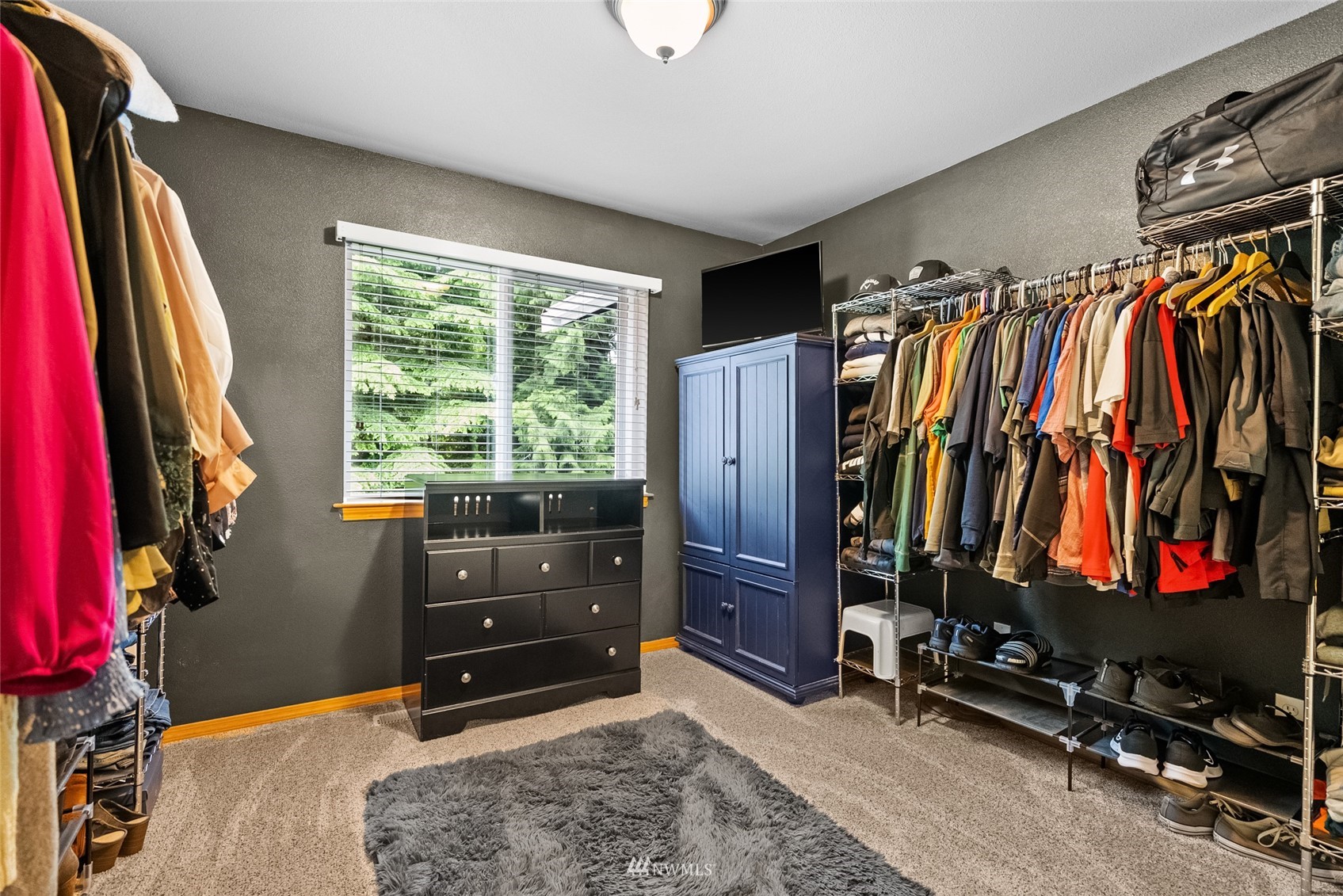 6741 Northwest Ranger Way Silverdale, WA 98383 - Photo 30 of 38 a view of walk in closet with clothes and shoes