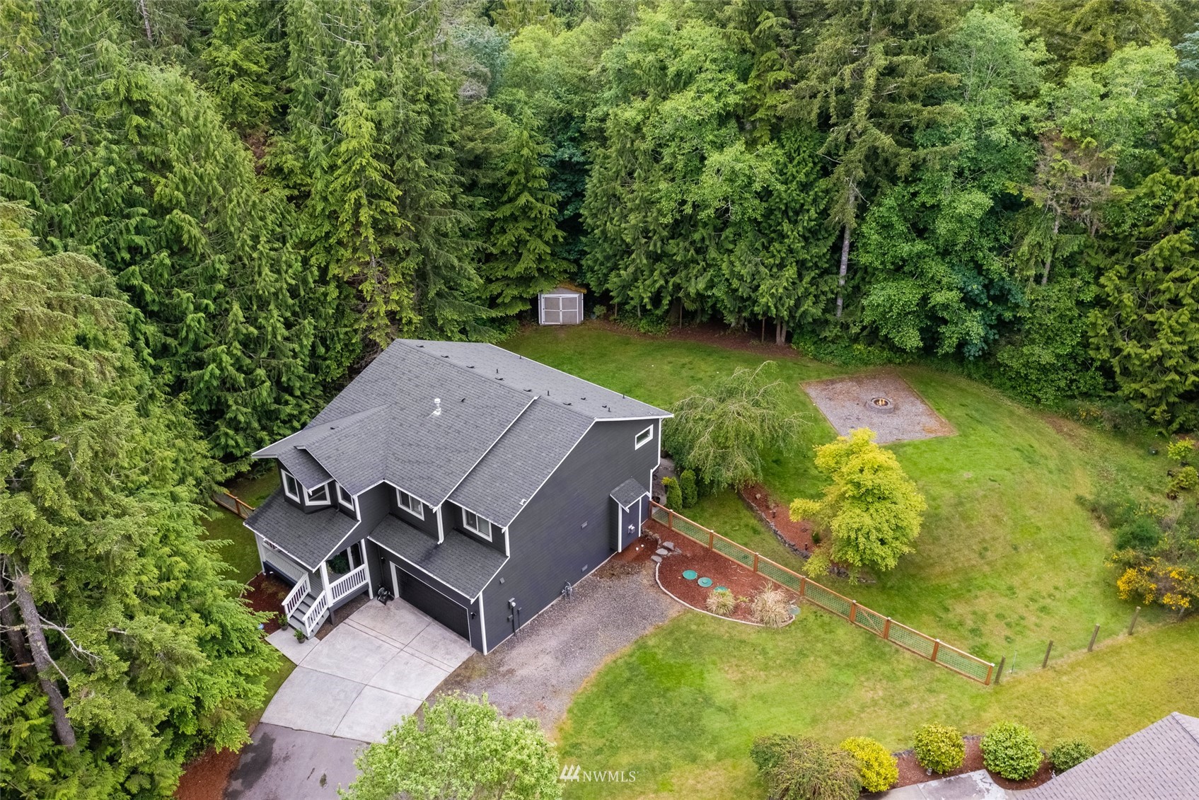 6741 Northwest Ranger Way Silverdale, WA 98383 - Photo 3 of 38 an aerial view of a house with a yard