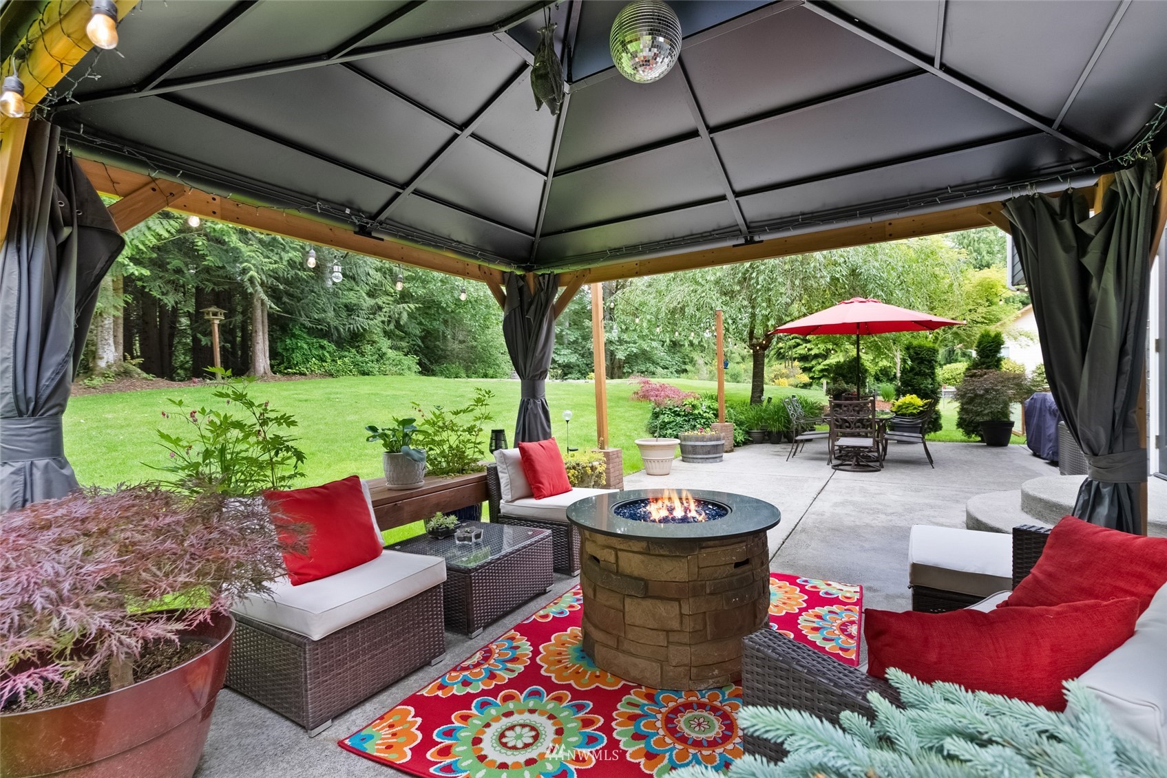 6741 Northwest Ranger Way Silverdale, WA 98383 - Photo 34 of 38 a view of an outdoor sitting area and garden