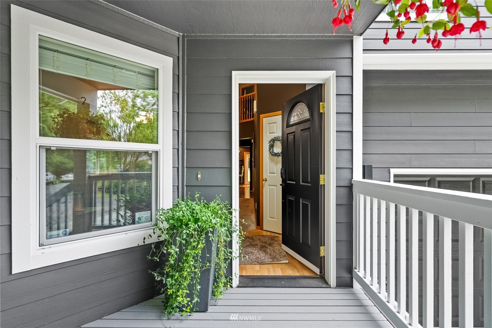 6741 Northwest Ranger Way Silverdale, WA 98383 - Photo 4 of 38 a front view of a house with a porch