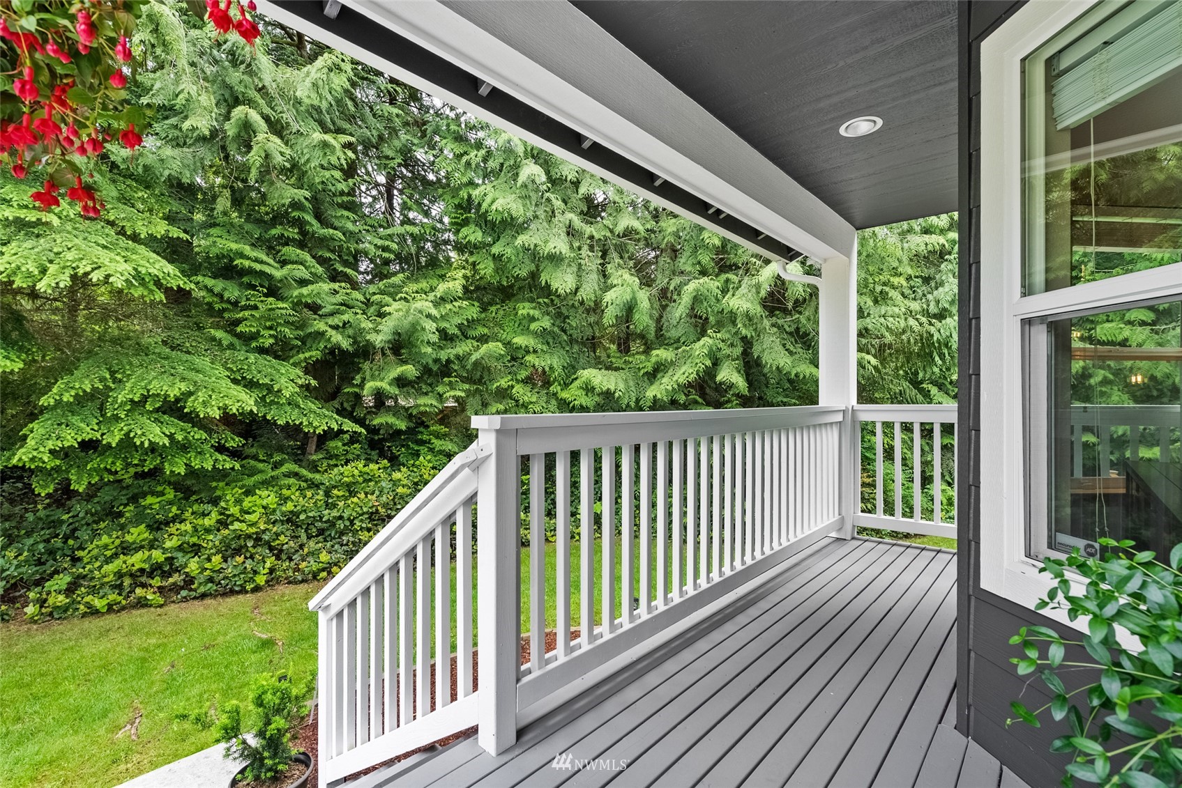 6741 Northwest Ranger Way Silverdale, WA 98383 - Photo 5 of 38 a view of a balcony with wooden floor