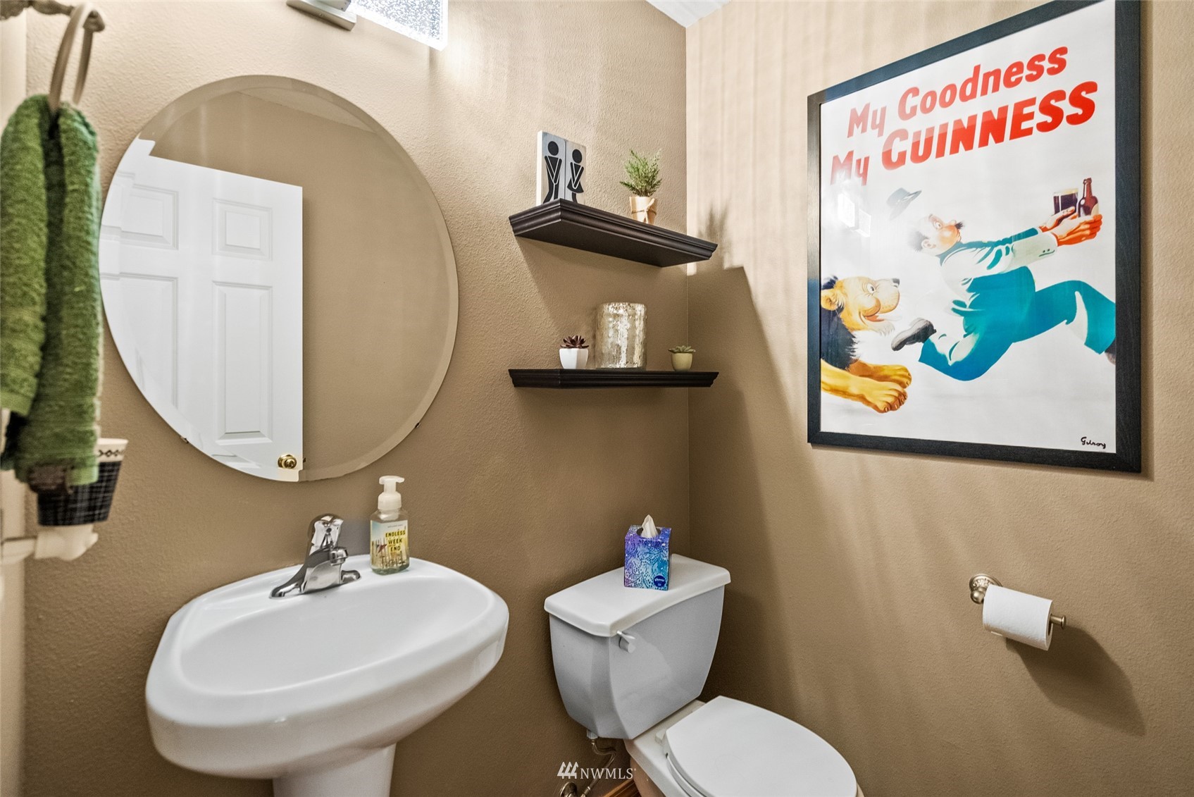 6741 Northwest Ranger Way Silverdale, WA 98383 - Photo 10 of 38 a bathroom with a toilet a sink and a mirror