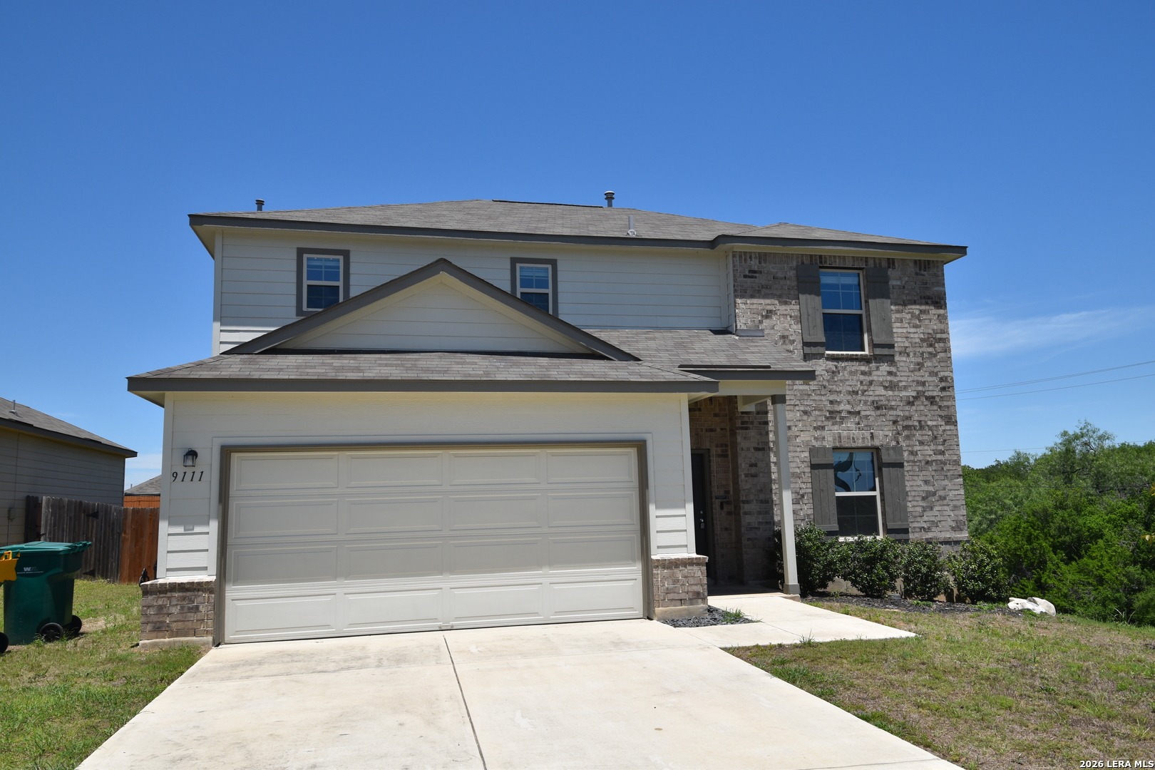 a front view of a house with yard