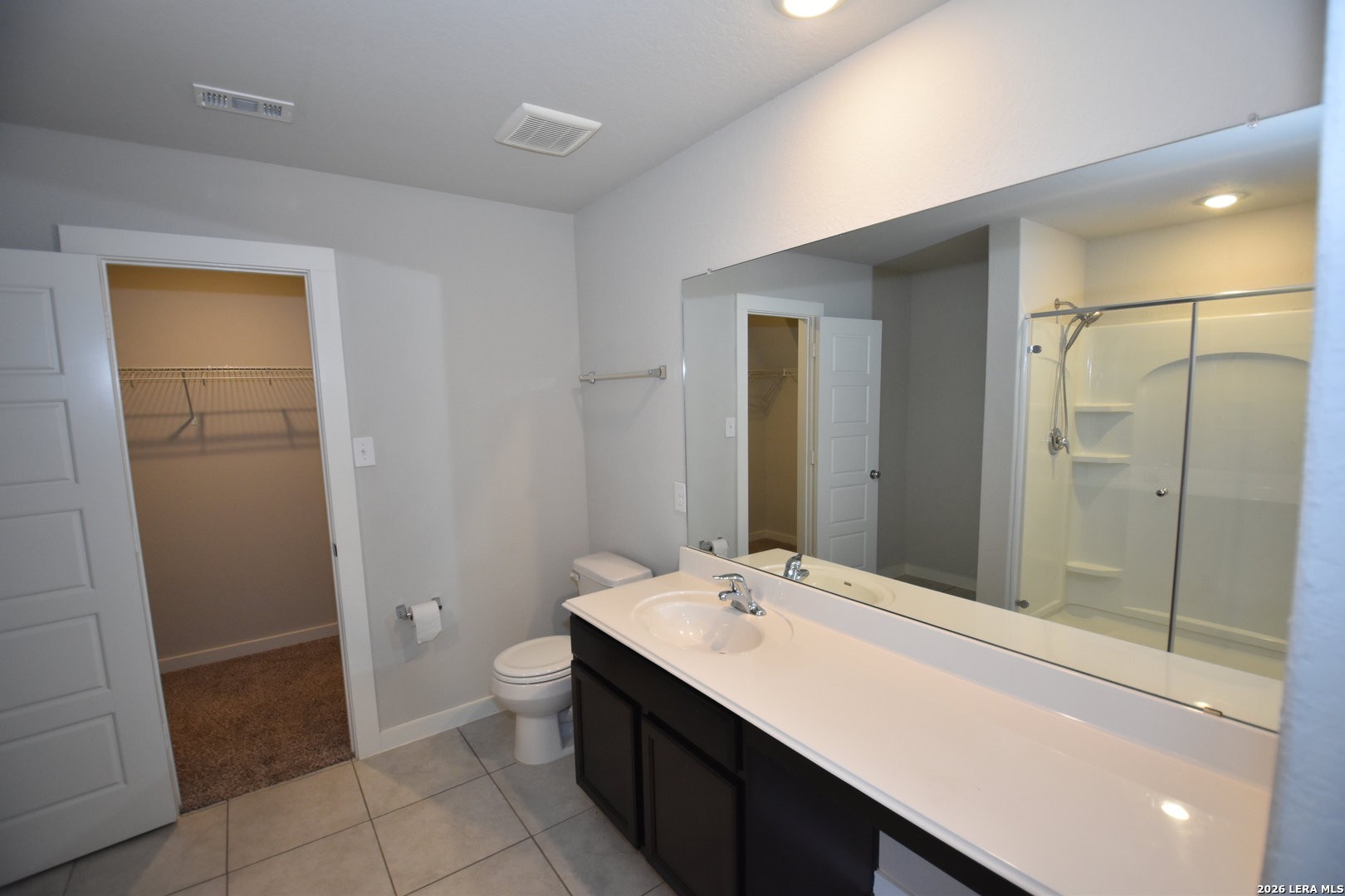 9111 Spigel Way Converse, TX 78109 - Photo 13 of 24 a bathroom with a sink a toilet and shower