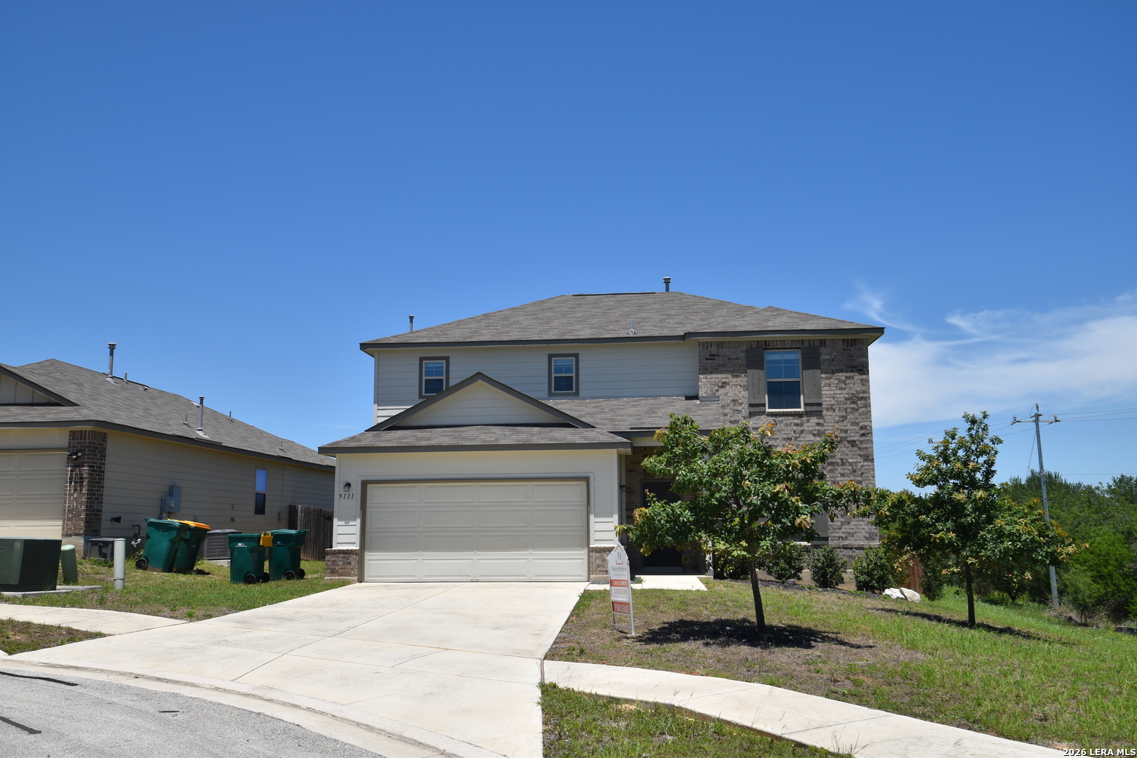 9111 Spigel Way Converse, TX 78109 - Photo 2 of 24 a front view of a house with a yard