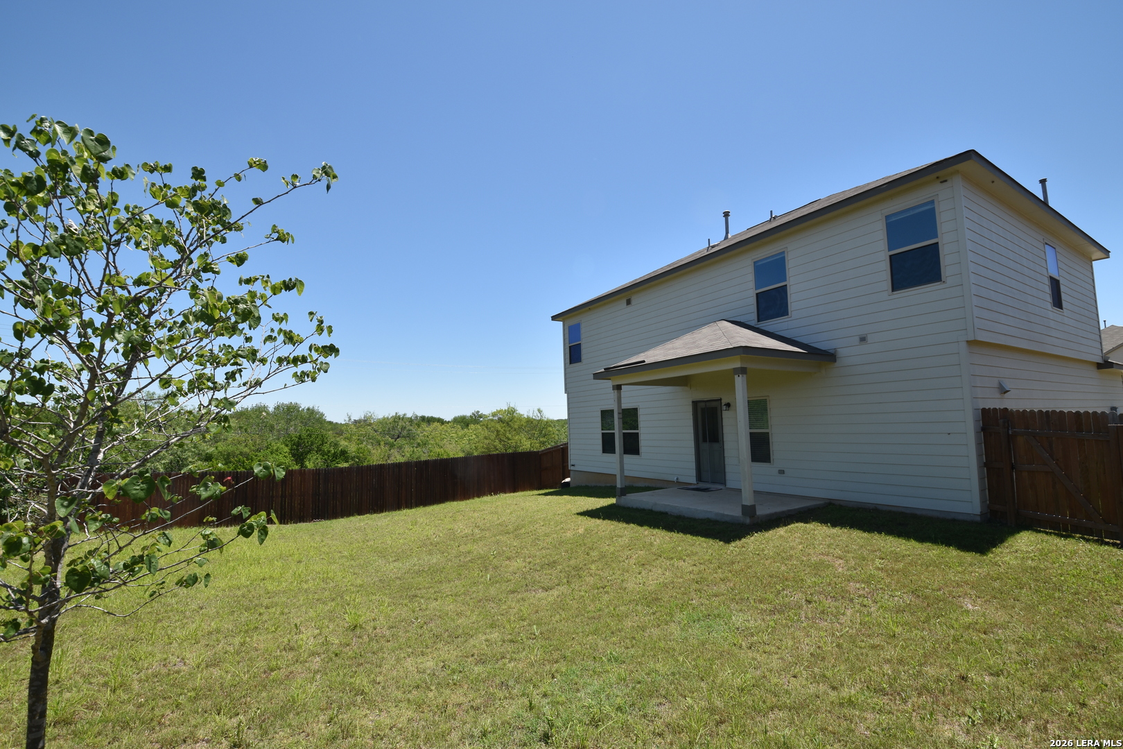 9111 Spigel Way Converse, TX 78109 - Photo 22 of 24 a front view of a house with a yard