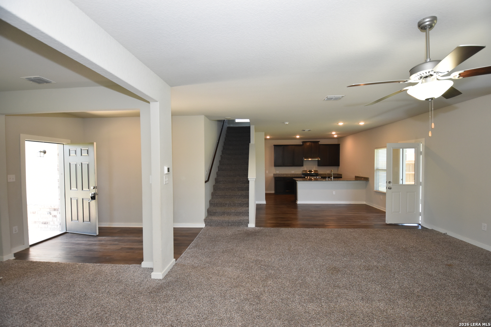 9111 Spigel Way Converse, TX 78109 - Photo 4 of 24 a view of a hallway with a kitchen