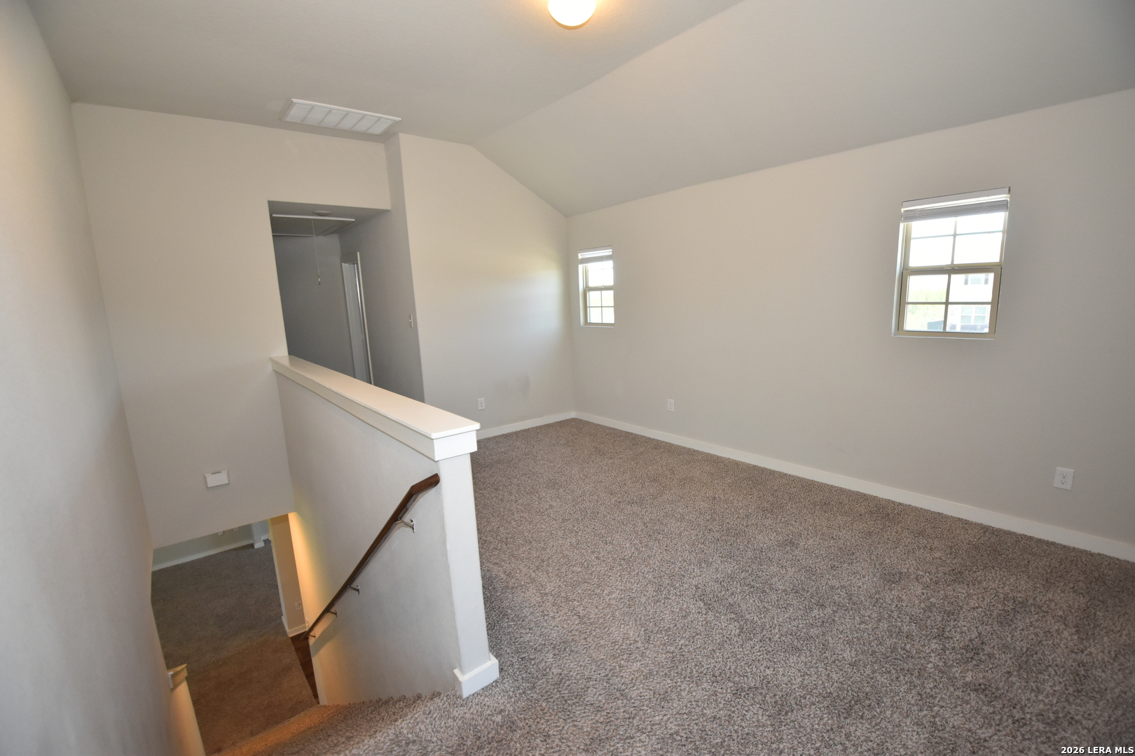 9111 Spigel Way Converse, TX 78109 - Photo 9 of 24 wooden floor in an empty room with a window