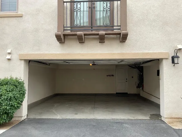 a room with a wooden floor and white wall