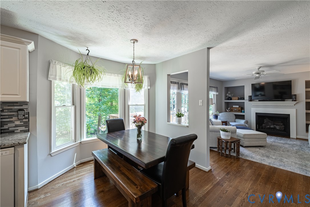 4501 Foxwood Road Chester, VA 23831 - Photo 9 of 42 Dining area featuring a bay window, hardwood floor