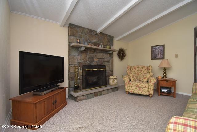 144 Lake In The Clouds Road Canadensis, PA 18325 - Photo 8 of 33 living room with fireplace