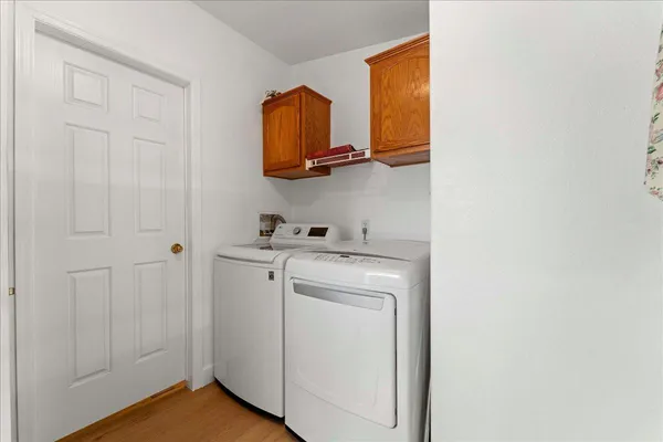 a view of storage and utility room with washer and dryer