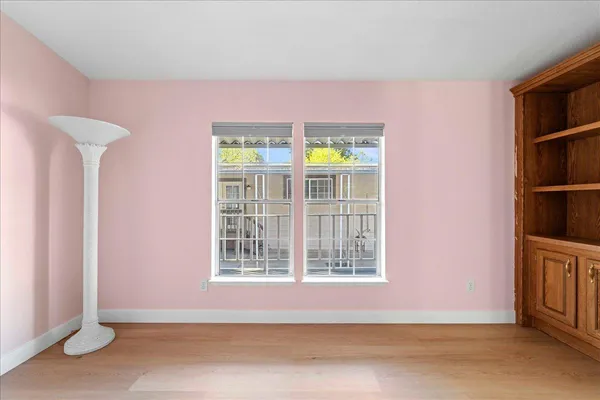 a view of an empty room with windows