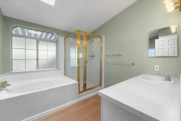 a bathroom with a bathtub and a sink