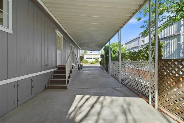 a view of entryway with wooden floor and stairs