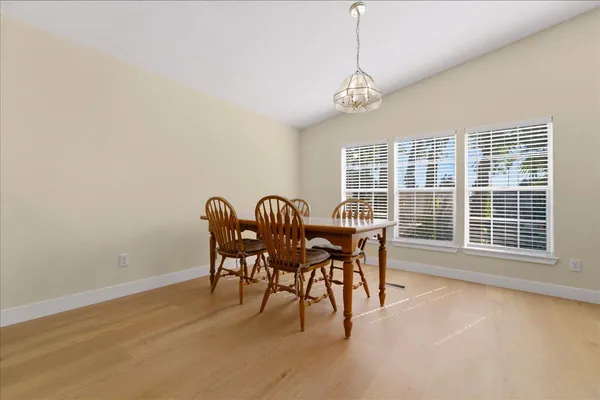 a view of a dining room with furniture window and outside view