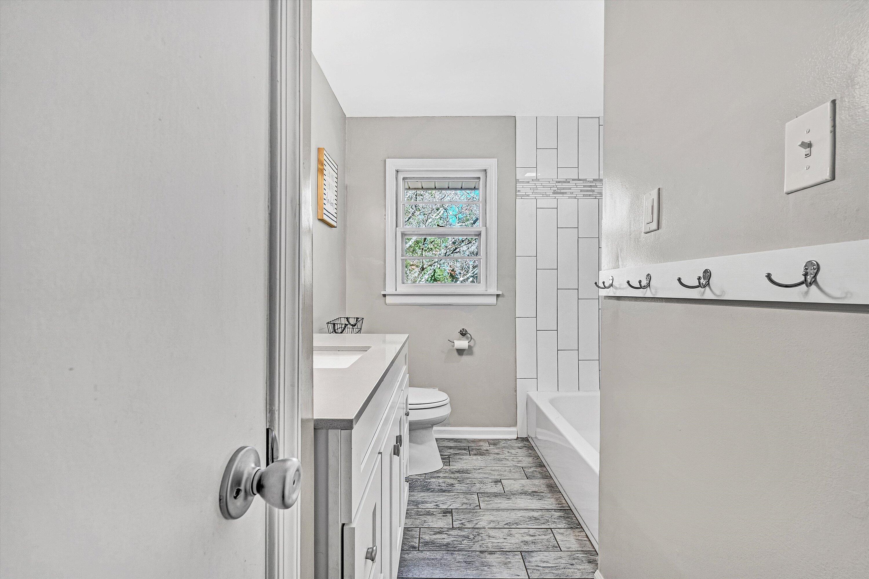 3558 Wright Road Southwest Roanoke, VA 24015 - Photo 13 of 30 a bathroom with a sink a toilet and shower