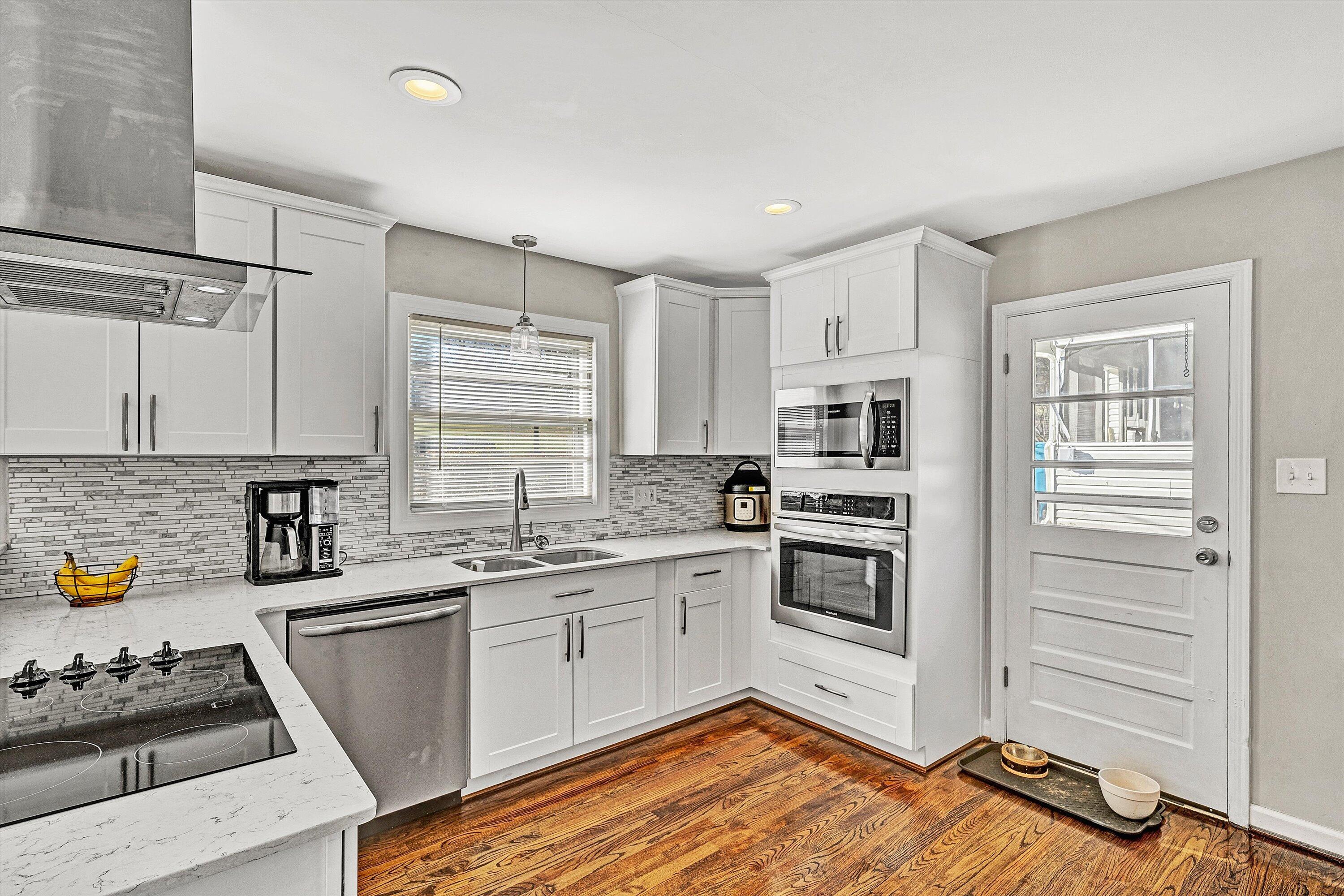 3558 Wright Road Southwest Roanoke, VA 24015 - Photo 8 of 30 a kitchen with stainless steel appliances a stove sink and refrigerator