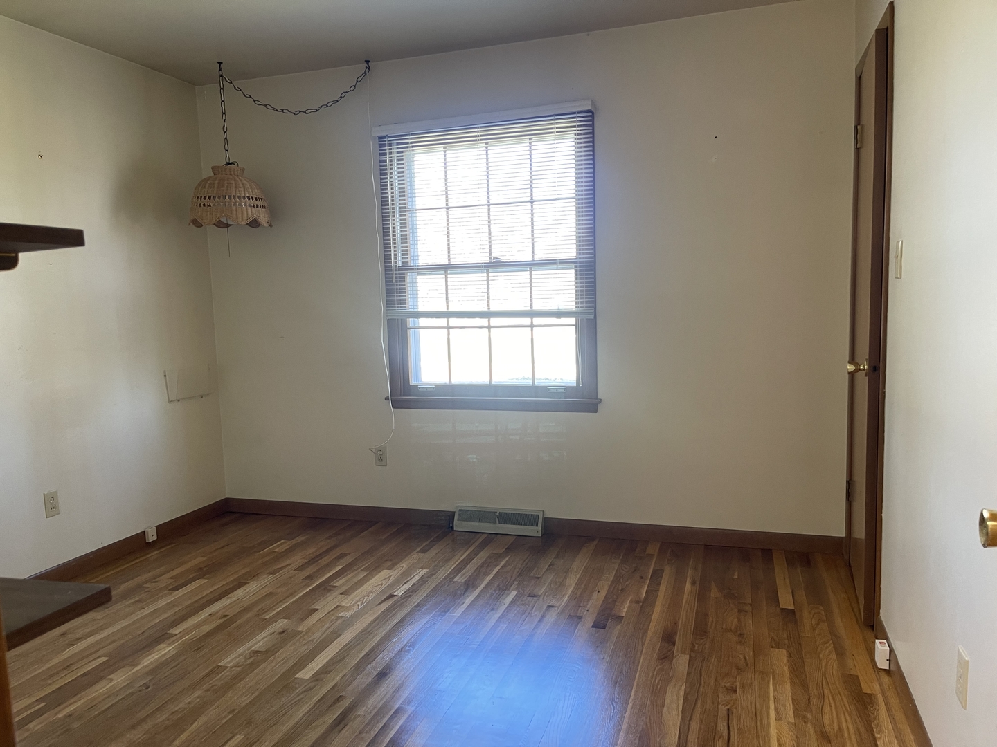 902 16th Street Peru, IL 61354 - Photo 12 of 23 an empty room with wooden floor and windows