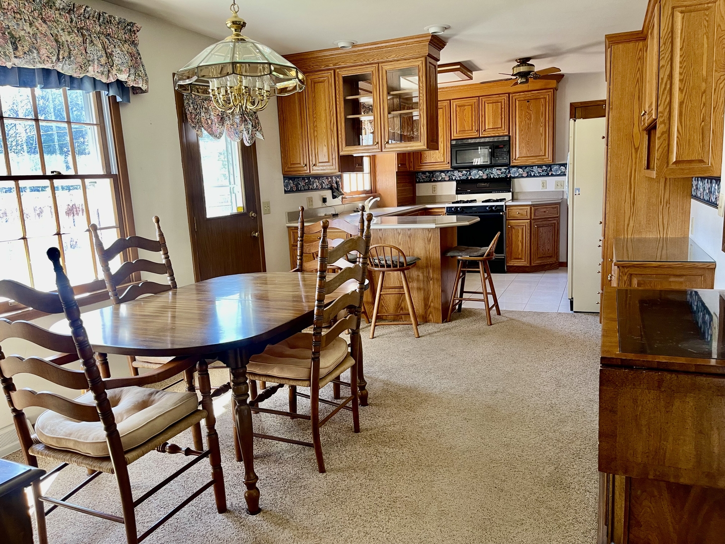 902 16th Street Peru, IL 61354 - Photo 8 of 23 a view of a dining room with furniture window and outside view