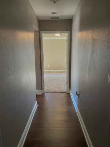 a view of front door with wooden floor