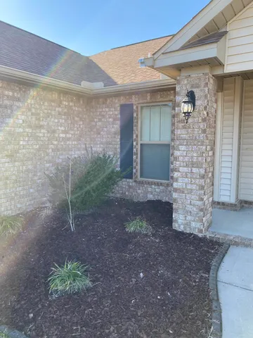 a view of a pathway both side of house