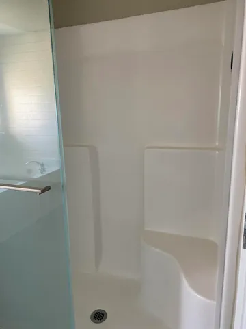 a bathroom with a bathtub and a sink